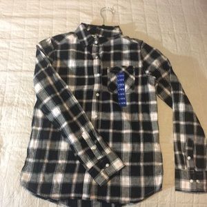 A kids flannel size L. Nice colors and buttons.